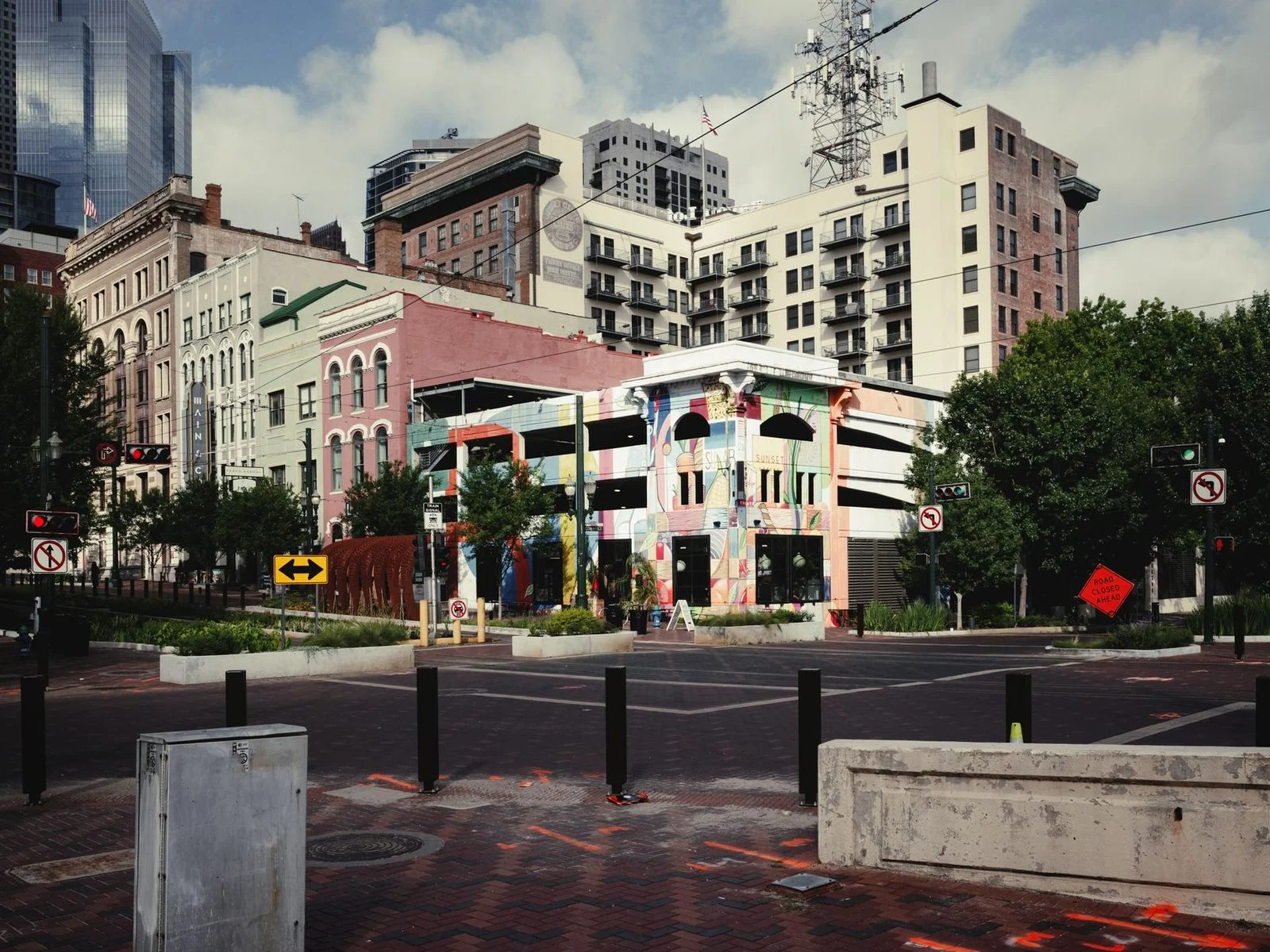 Colorful buildings and urban design along a busy downtown Houston street.