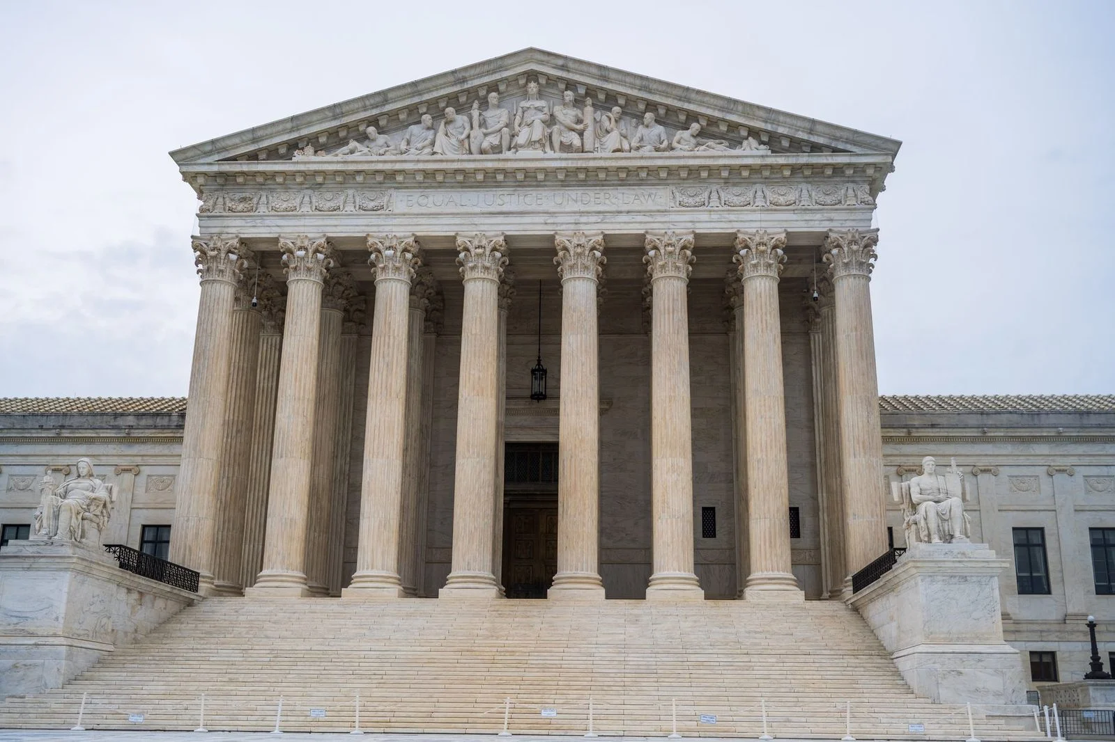The front facade of the U.S. Supreme Court building, with its grand columns and classic architecture.