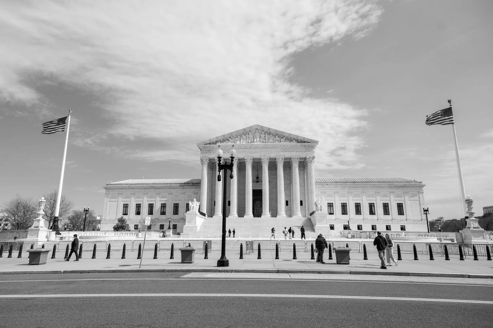 The U.S. Supreme Court building in Washington, D.C., with its white neoclassical columns and front steps.