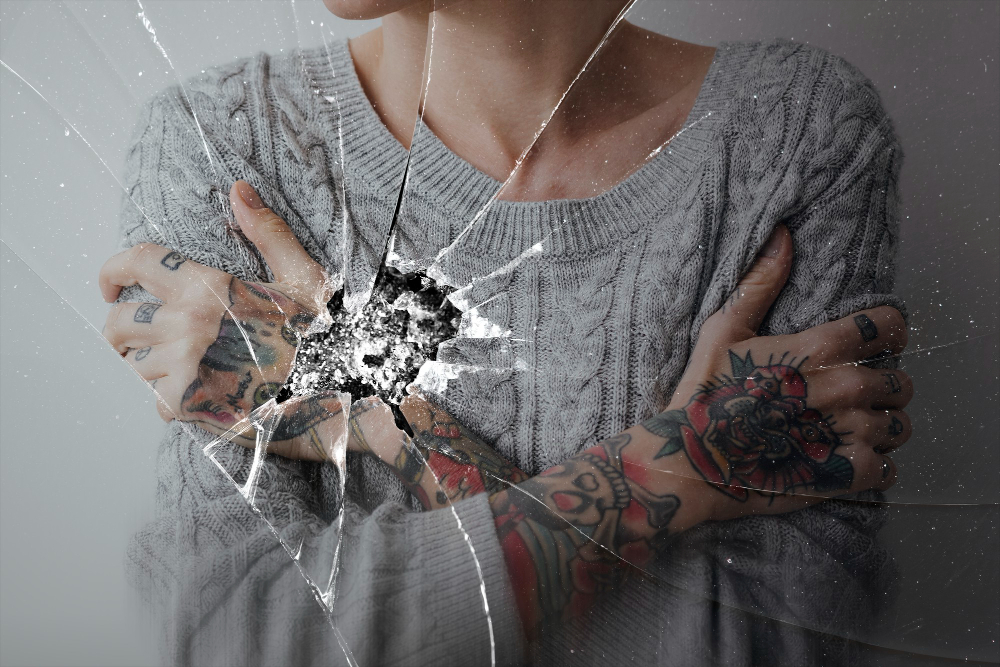 cracked-glass-effect-with-depressed-woman-background